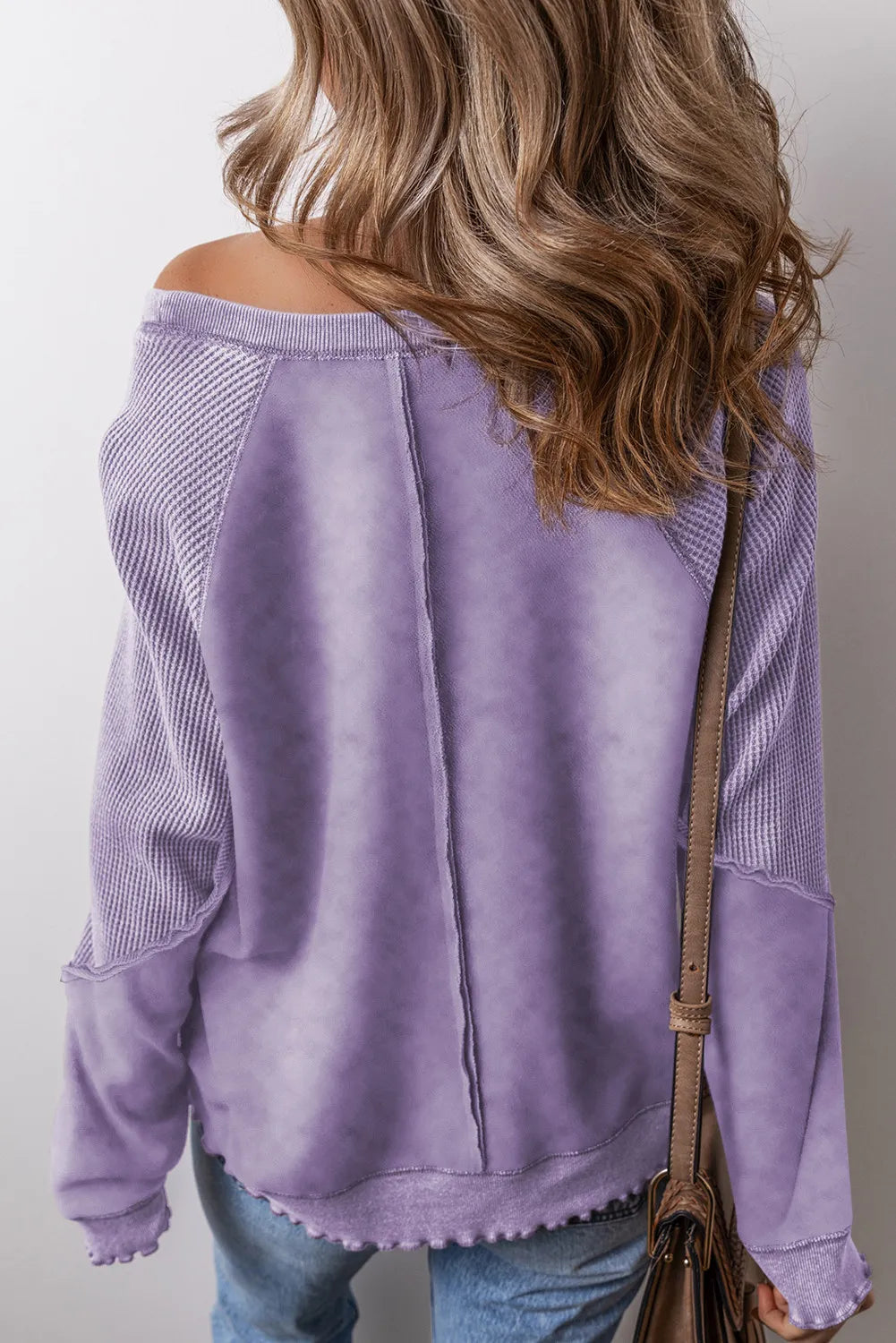 Exposed Seam Long Sleeve Sweatshirt.