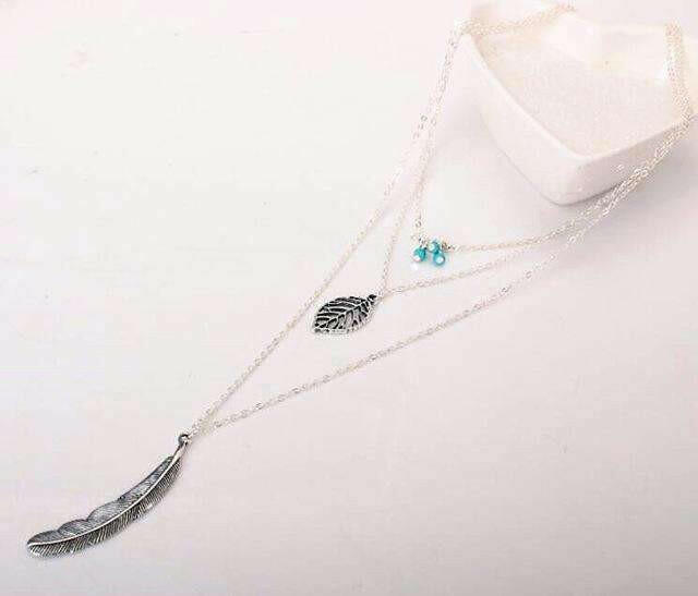 Nature's Whisper Turquoise Leaf Feather Multi Layer Necklace: A Tribute to Earthy Elegance and Timeless Style - Versatile Layers with Natural Beauty.